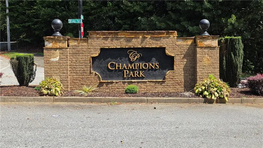 Brick and stone entrance monument with decorative finials