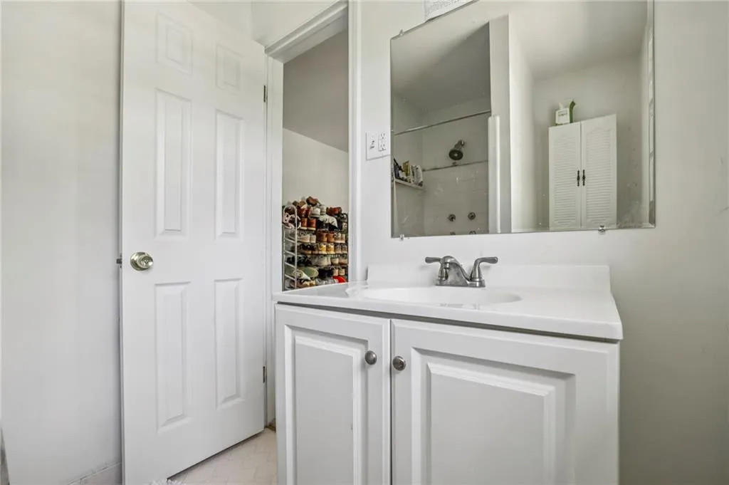 Bathroom with a shower and vanity