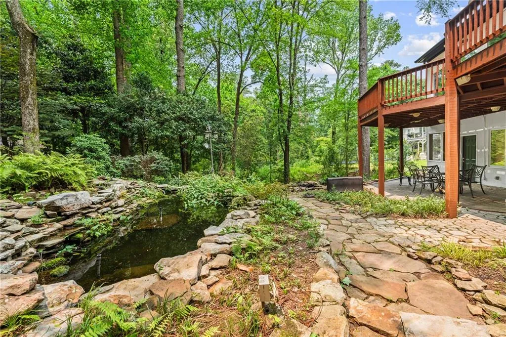 View of yard with a patio and a deck