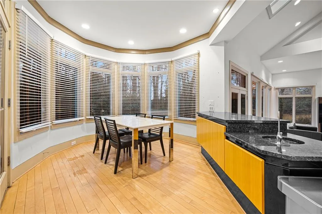 Dining area featuring light wood-style floors and recessed lighting