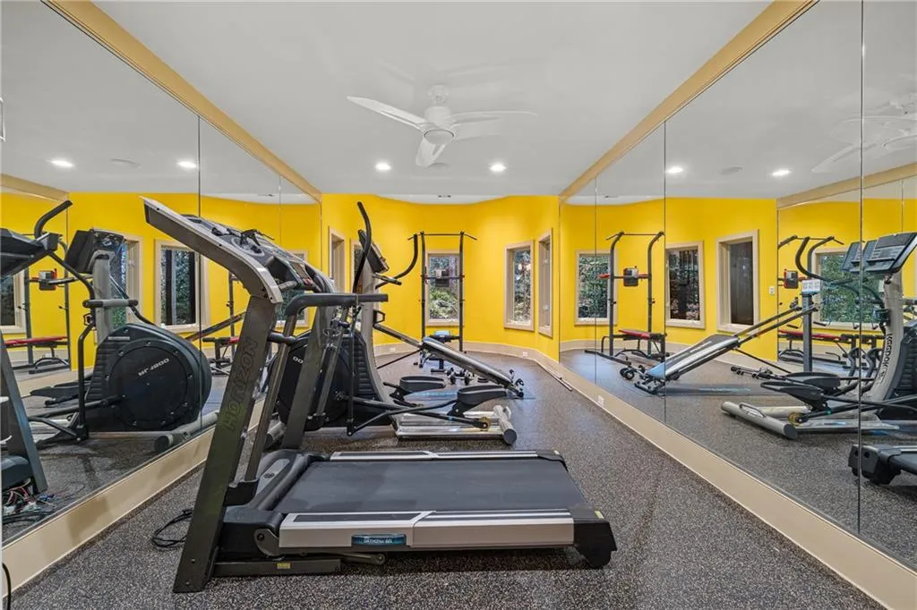 Exercise room with ceiling fan and recessed lighting