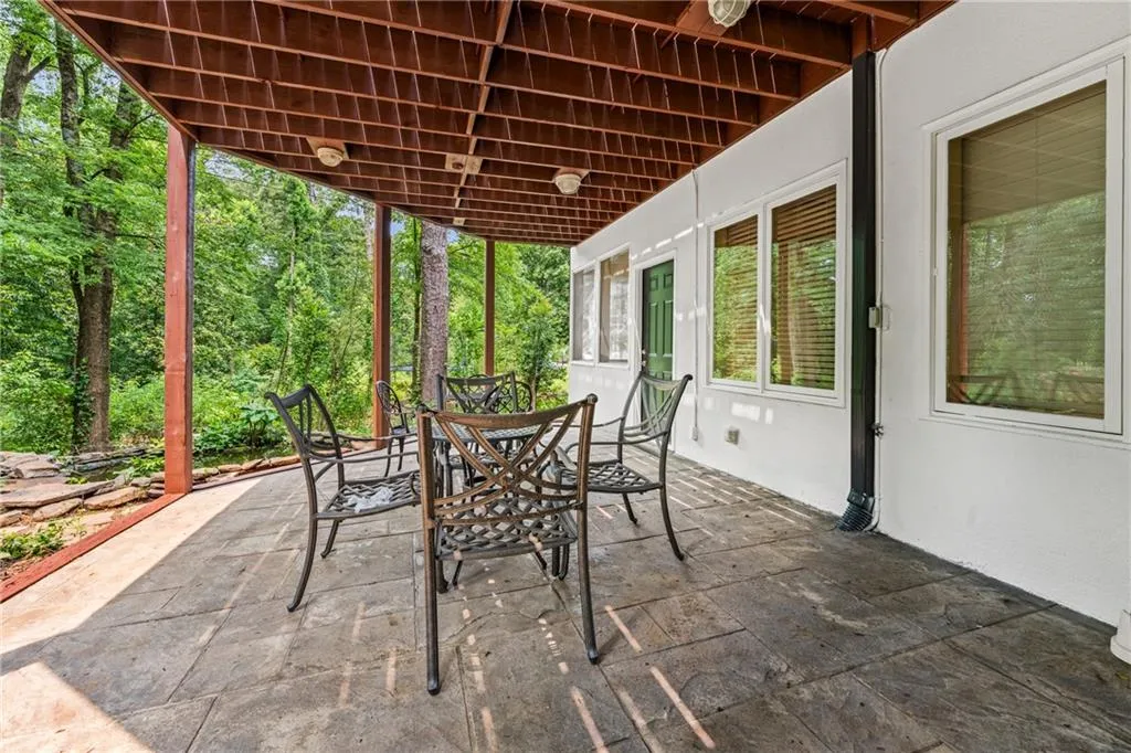 View of patio with outdoor dining area