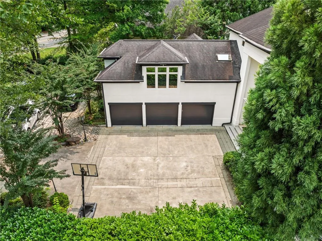 View from above of property with a tree filled landscape