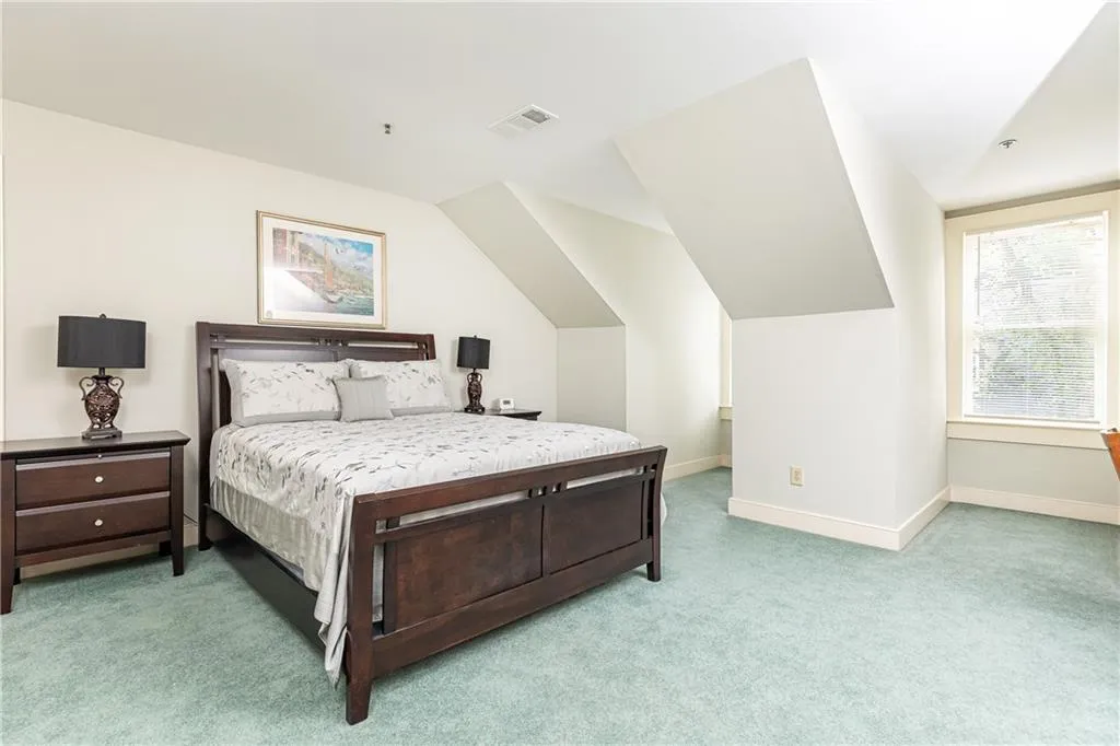 Two large bedrooms upstairs complete this spacious home.