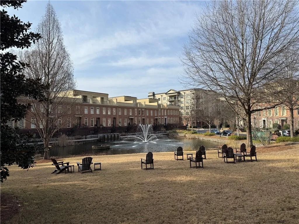 View of property's community featuring a yard and a patio