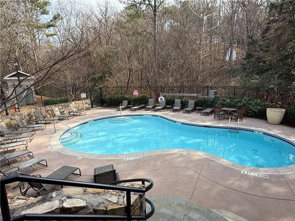 Community pool with a patio area
