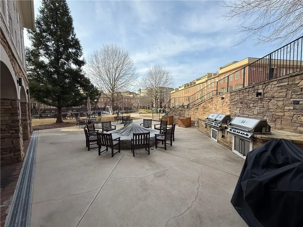 View of patio / terrace with exterior kitchen and an outdoor fire pit