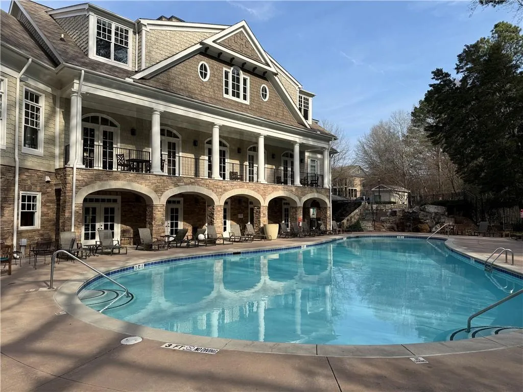 Community pool featuring a patio and french doors