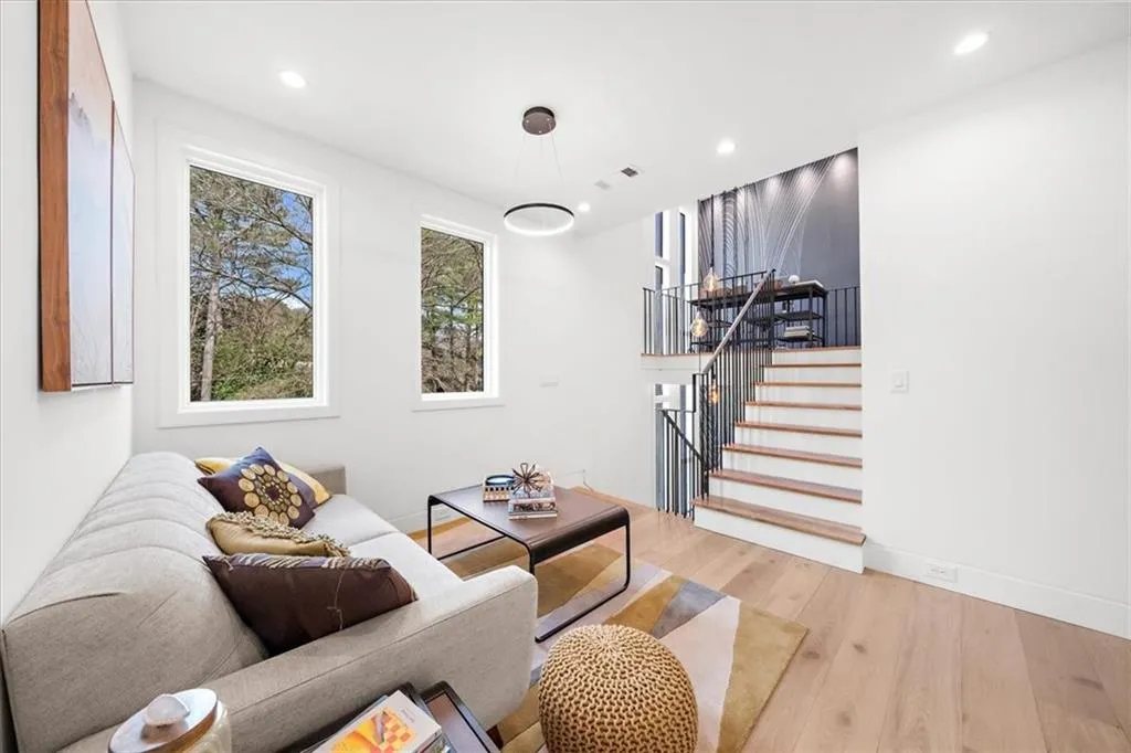 Upper floor sitting area with stairs to work space