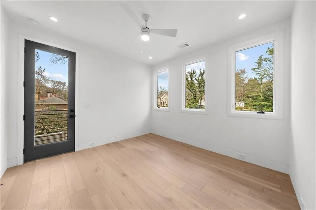 Main floor Guest bedroom with door onto wrap around terrace