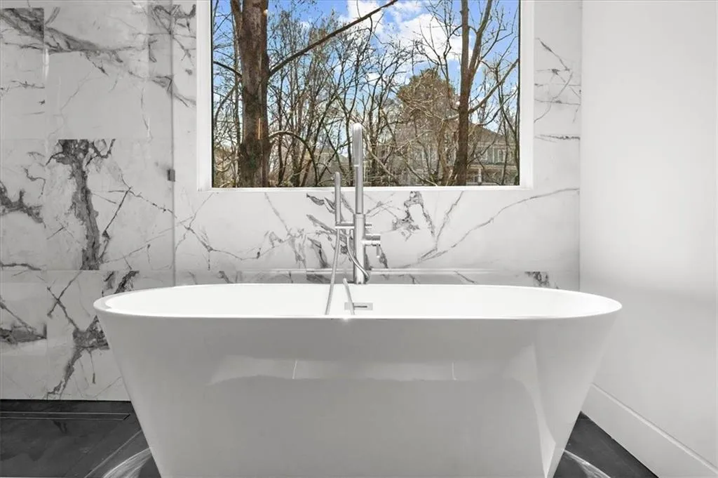 Master ensuite bathroom with shower, soaking tub and walk-in closet