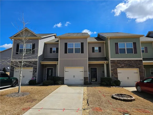 Multi unit property featuring a garage