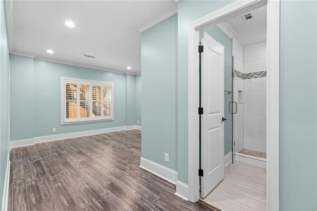 Corridor with ornamental molding and tile floors