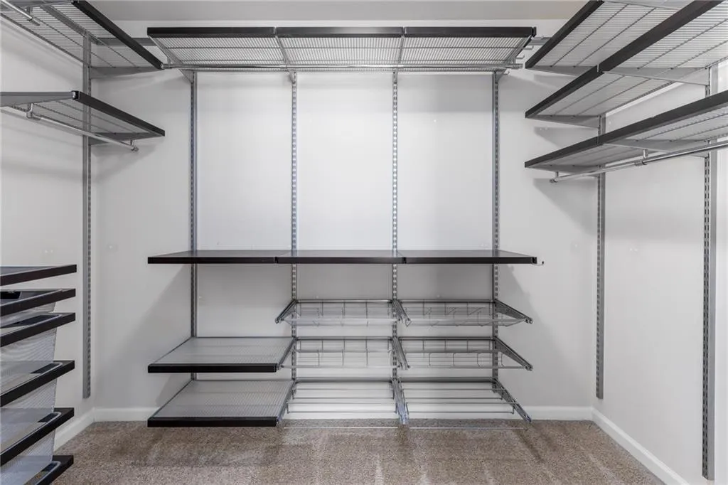 Walk in closet with carpet flooring