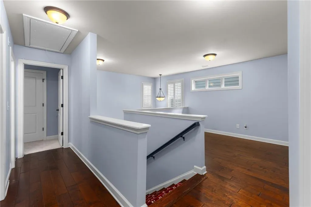 Hall featuring dark hardwood / wood-style flooring