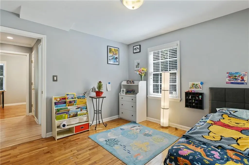 Bedroom featuring light wood-style floors and baseboards
