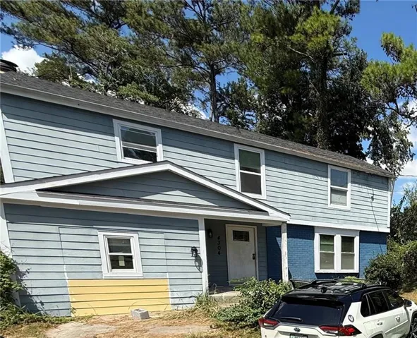 Two-story exterior with light blue and dark blue siding
