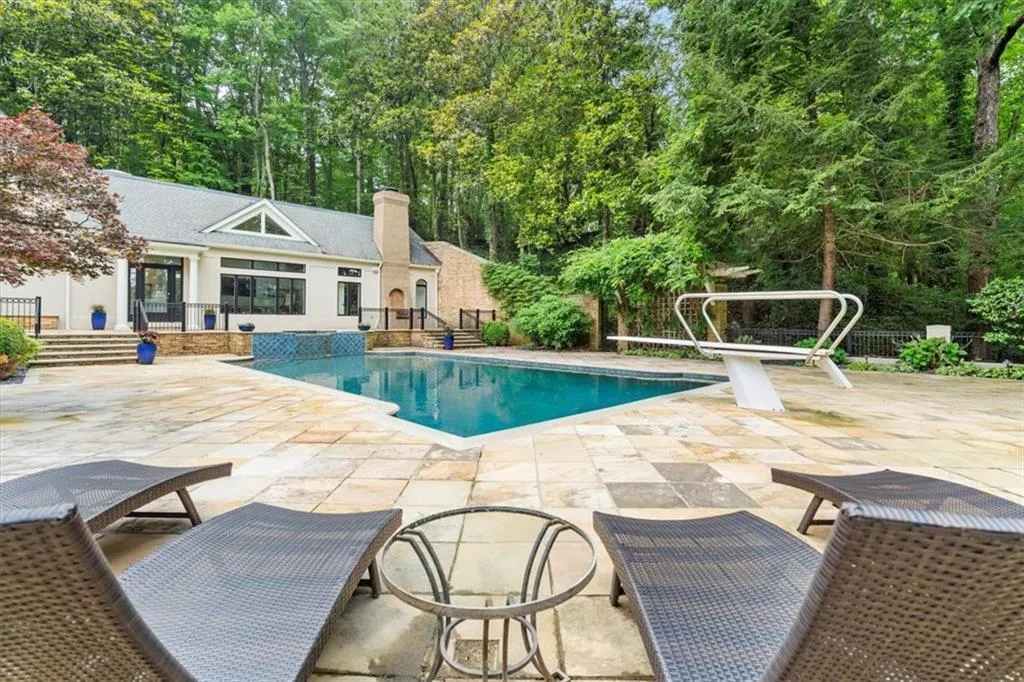 View of pool with a patio area View of pool with a patio area