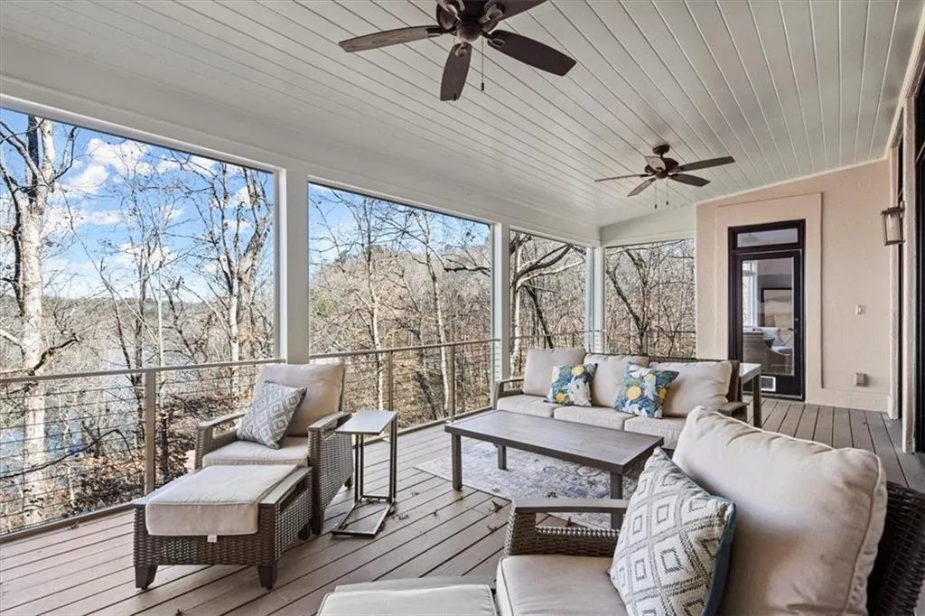 Sunroom featuring plenty of natural light, vaulted ceiling, wooden ceiling, and ceiling fan Sunroom featuring plenty of natural light, vaulted ceiling, wooden ceiling, and ceiling fan