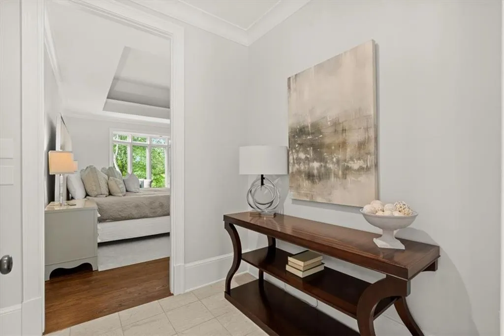 Tiled office space with crown molding and a raised ceiling Tiled office space with crown molding and a raised ceiling