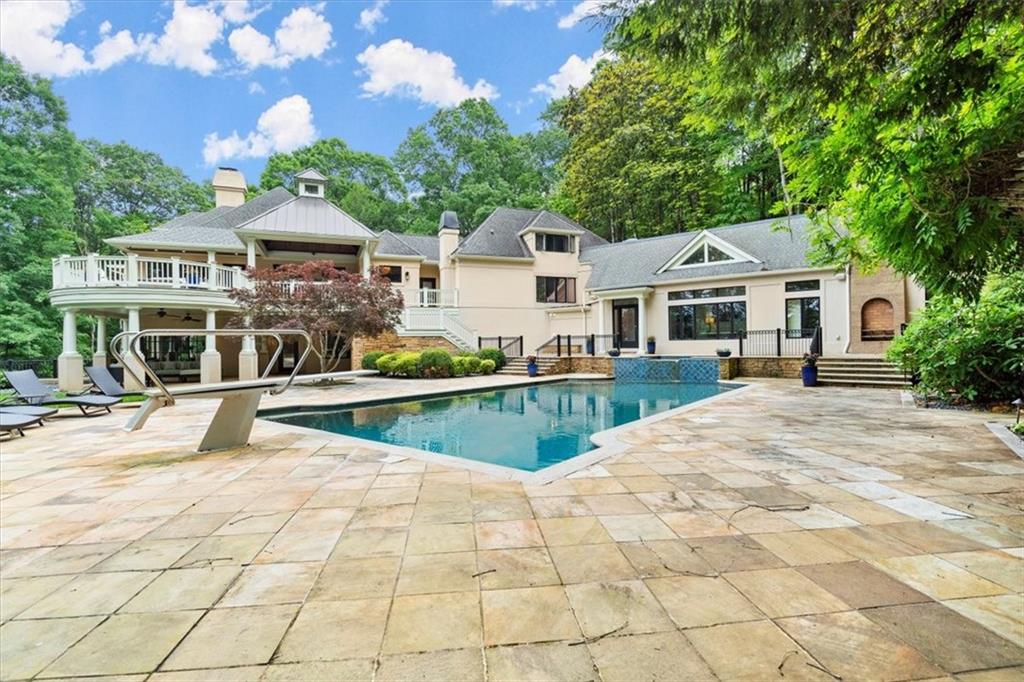 View of swimming pool with a patio area View of swimming pool with a patio area