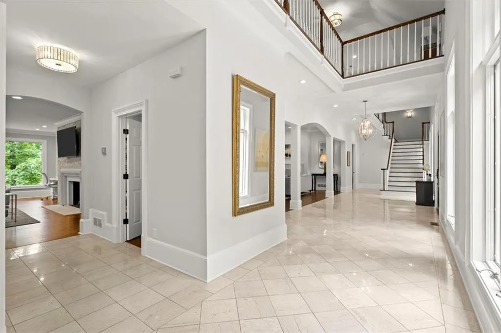 Hall featuring light tile floors Hall featuring light tile floors