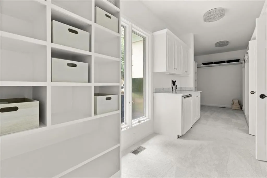 Walk in closet with light carpet Walk in closet with light carpet