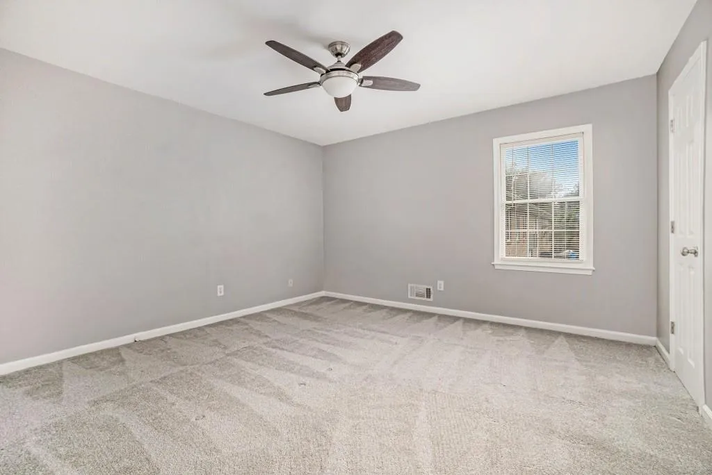 Upstairs, you'll find Two Spacious Bedrooms and a Fully Renovated Bathroom boasting a Tiled Glass Shower, Extended Stone Vanity with ample Storage, and Tiled Flooring.