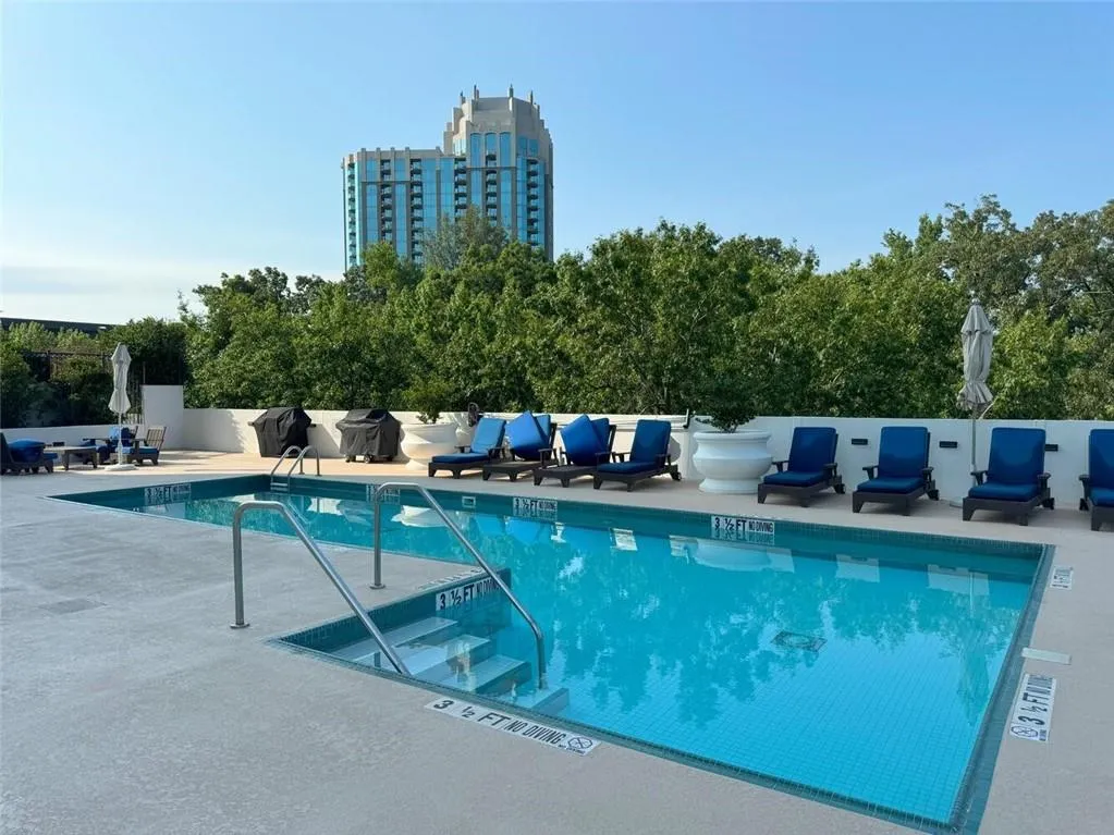 Community pool featuring a patio