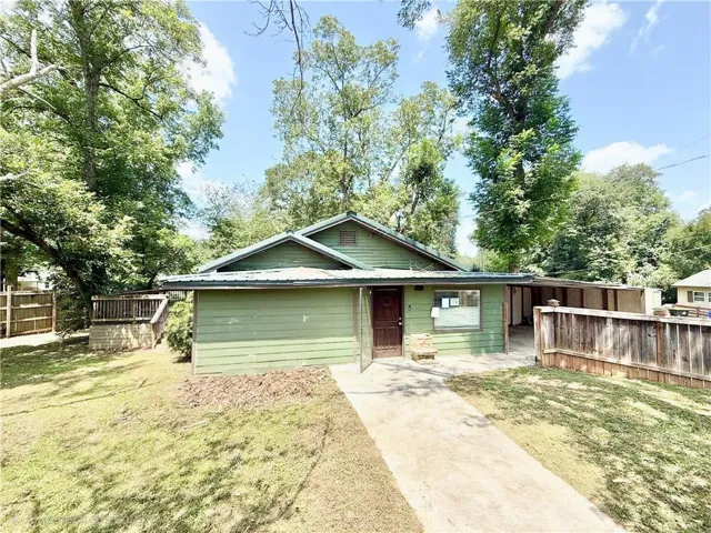 Green-sided exterior with a metal roof