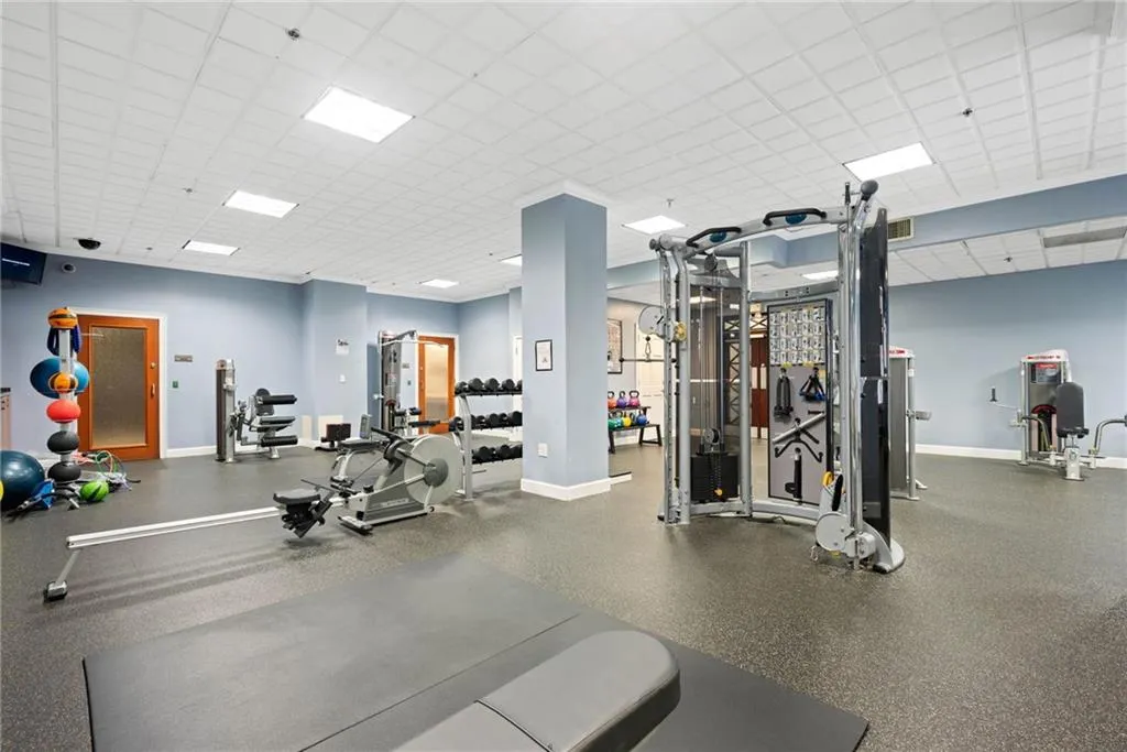 Gym with a paneled ceiling