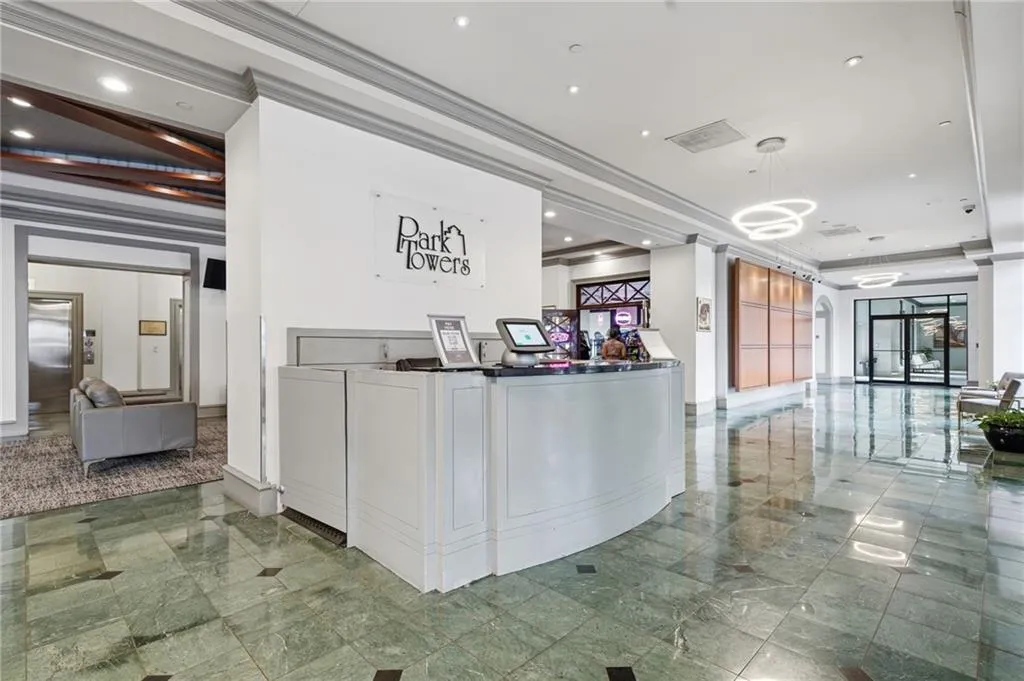 Reception featuring ornamental molding and recessed lighting