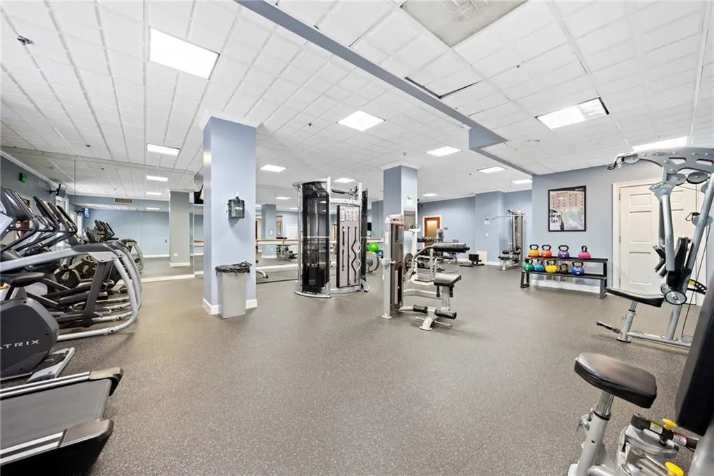 Exercise room featuring a drop ceiling