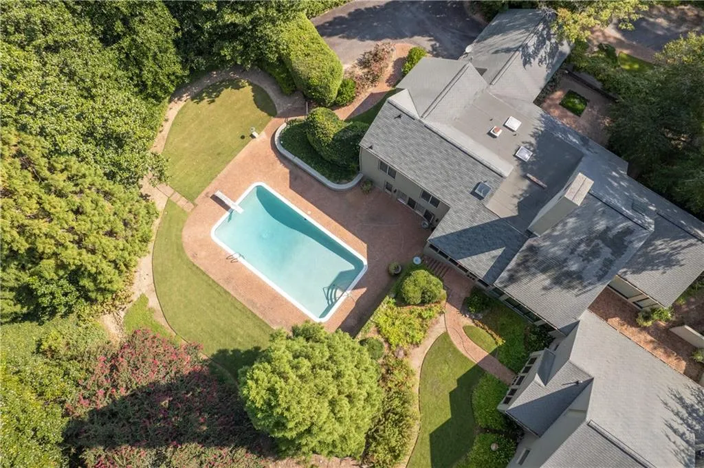 View of subject property featuring a pool