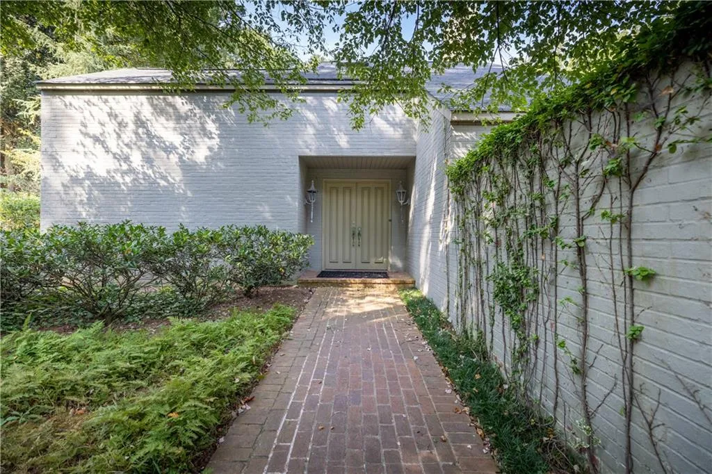 Entrance to property with brick siding