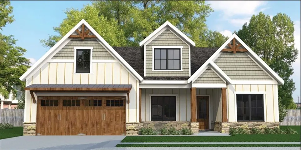 Craftsman-style facade featuring prominent gables with decorative brackets, board and batten siding, and shake accents