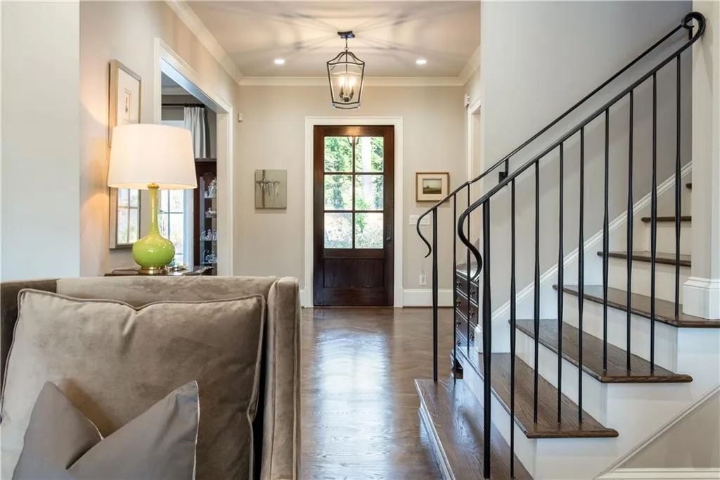 Custom iron railings lead to upper level