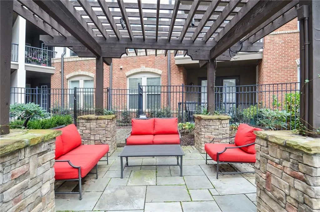 View of patio featuring a balcony, a pergola, and outdoor lounge area