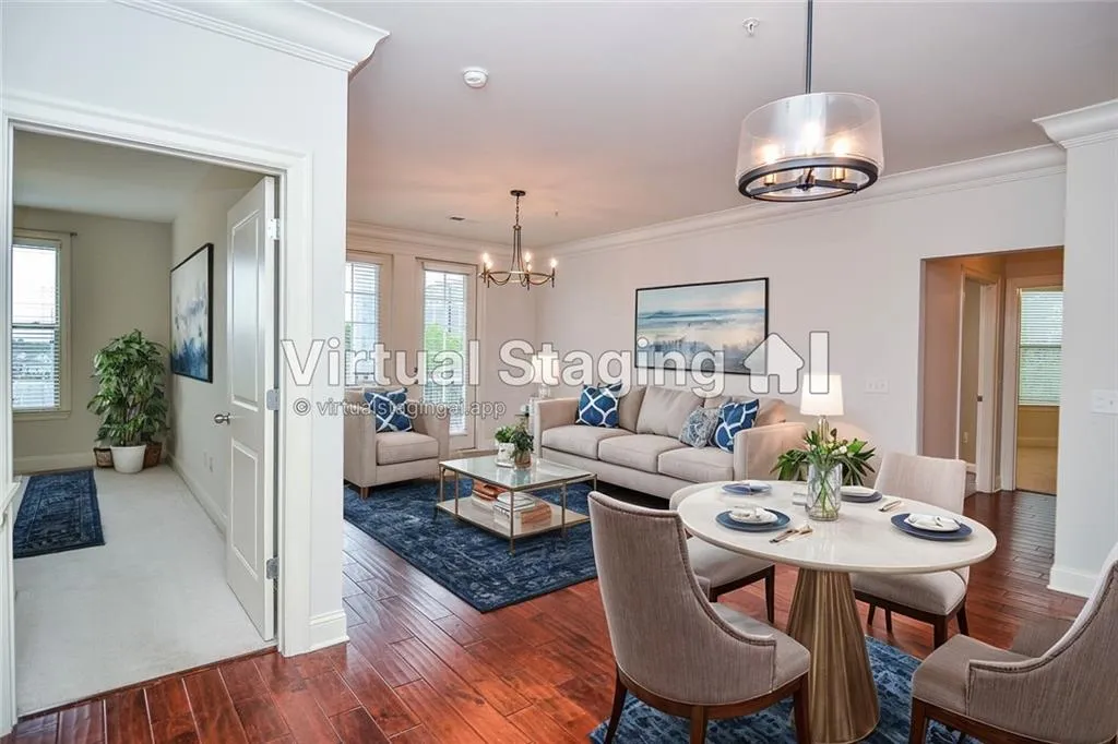 Living room featuring plenty of natural light, dark hardwood / wood-style flooring, and crown molding