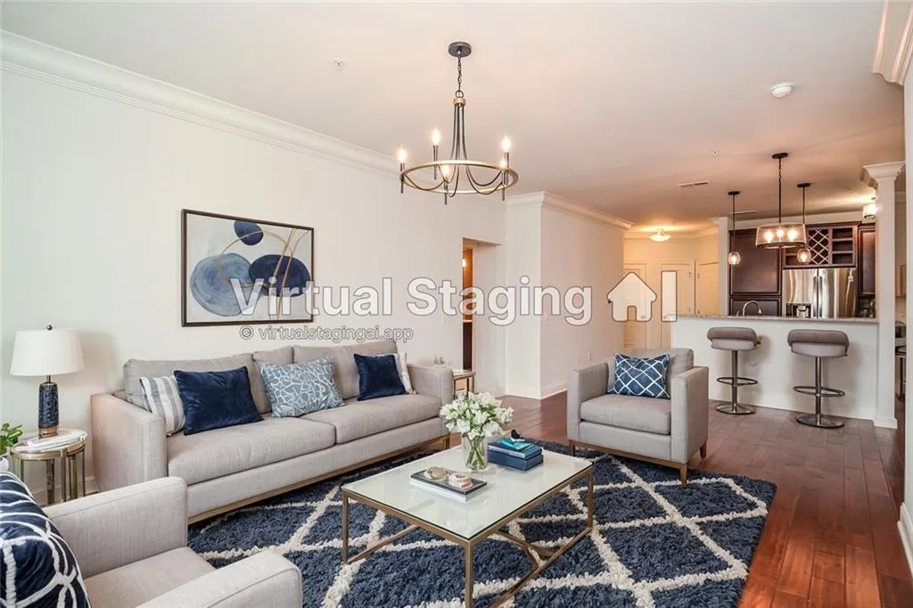 Living room with ornamental molding, a notable chandelier, and dark hardwood / wood-style flooring