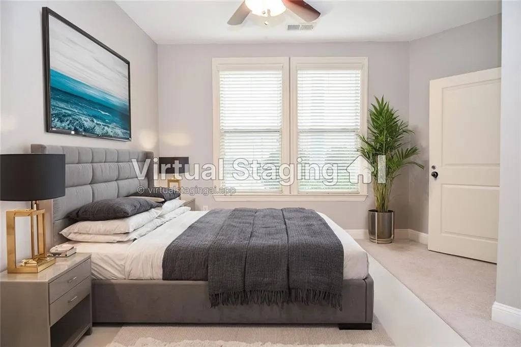 Carpeted bedroom featuring ceiling fan
