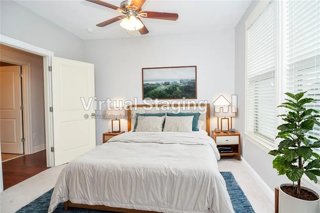 Bedroom featuring ceiling fan and light wood-type flooring