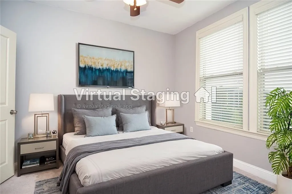 Bedroom featuring ceiling fan and light carpet