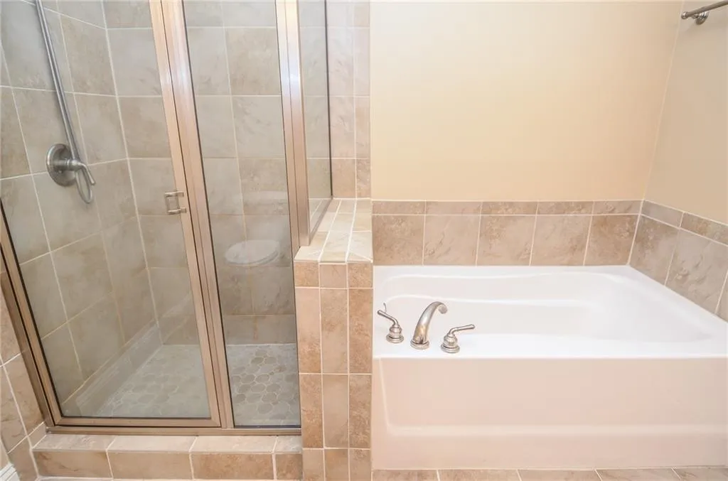 Bathroom with plus walk in shower