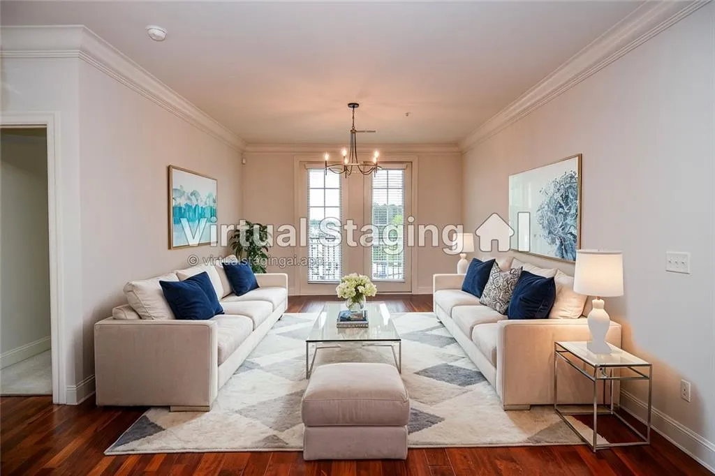Living room featuring crown molding, an inviting chandelier, and dark wood-type flooring