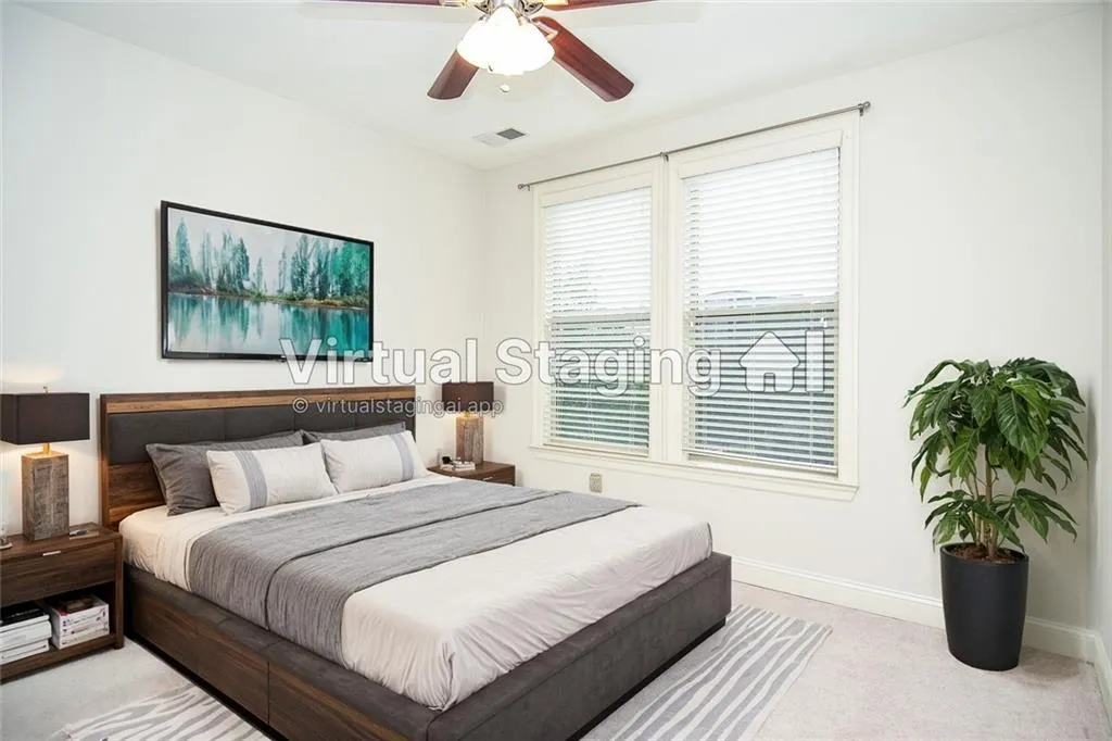 Bedroom with light carpet and ceiling fan