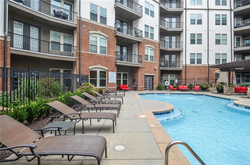 View of swimming pool with a patio