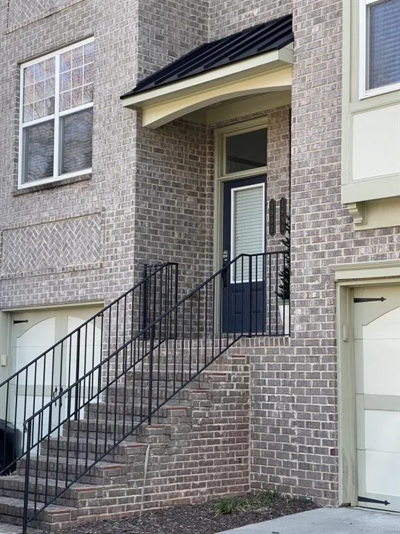 Front of this Lovely Townhome in Gated Cobblestone at Brookhaven