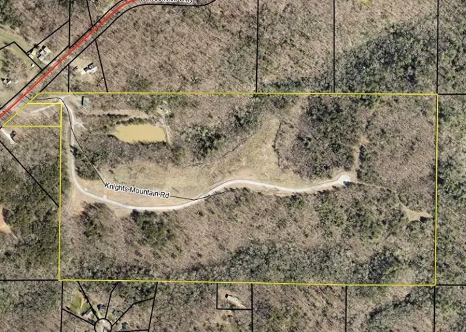 Plat Map. Illustrating the property boundaries, a private road, and a water feature within the delineated area