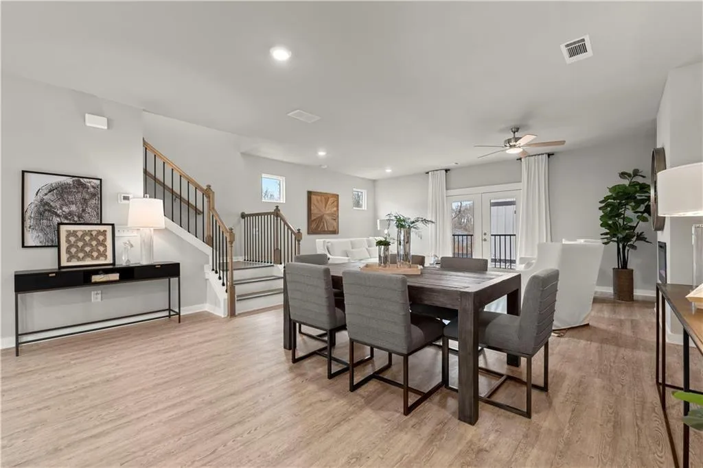 Dining area featuring french doors, recessed lighting, stairway, light wood-type flooring, and a ceiling fan
